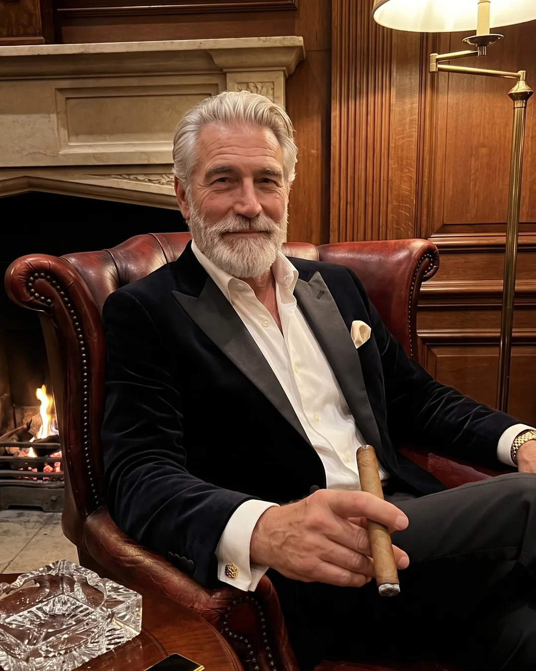 Don Vicente in a leather armchair by the fire in a private members club